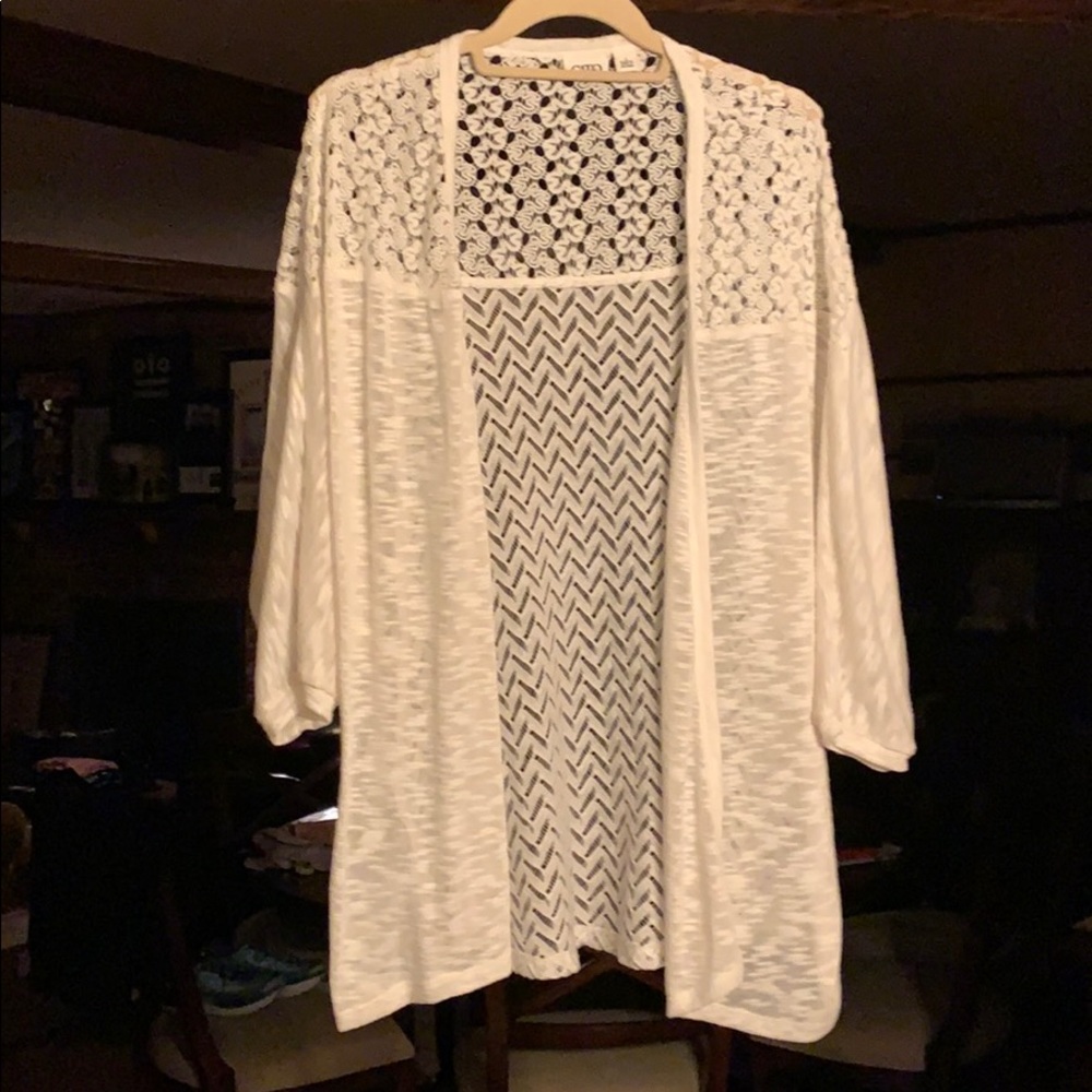 White sweater jacket.